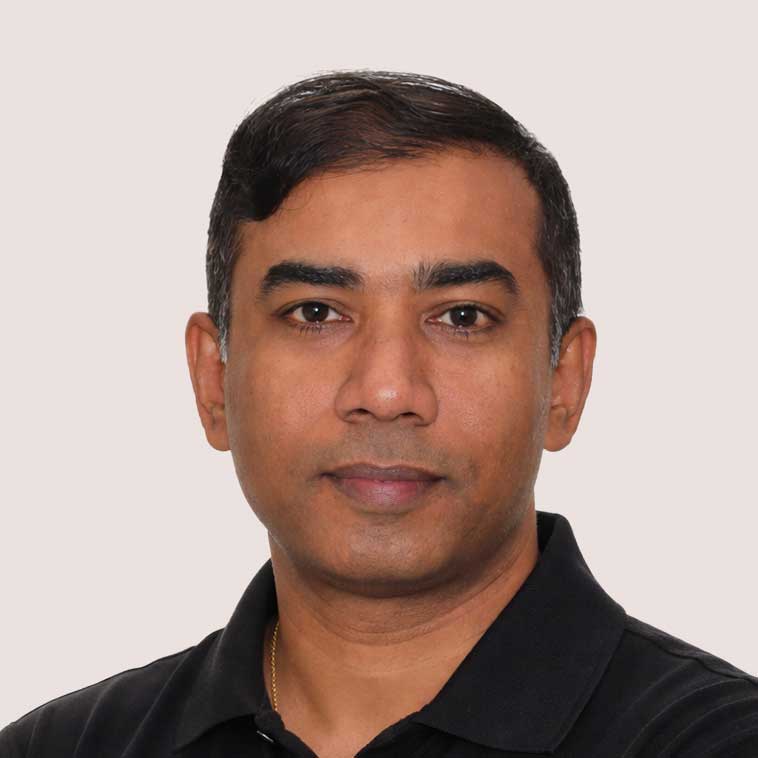 Professional portrait of a man in a black polo shirt for GM & F Partners.